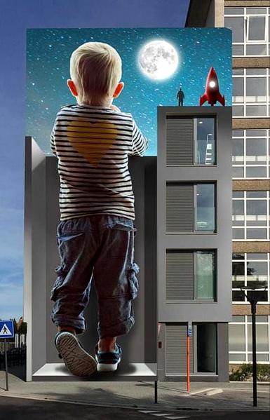 Streetartwall. A mural showing a child looking at the moon was sprayed/painted on the outside of a five-storey hospital building. A small blond boy in jeans and a blue and white striped shirt with a yellow heart on it is depicted from behind. He stands oversized in front of a spray-painted gray wall in 3D, which is perfectly adapted to the four-story area next to it. The boy is looking up at a starry sky with a full moon. Next to him and above the real windows of the area is a small astronaut with a red rocket.
Info: The depiction was intended to show that people want to look beyond the walls of the hospital and stay in contact with citizens, patients and culture. A hospital for everyone that also focuses on the future and the interaction between people and technology.