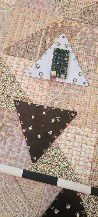 Hackerboxes tesselate tile on the Time for Tessellation quilt prototype. It's been sewn down with a custom buttonhole stitch on a machine.