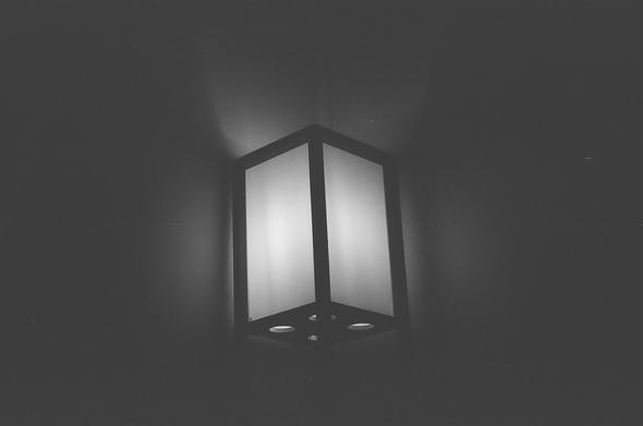 Underexposed black and white photograph of a lamp