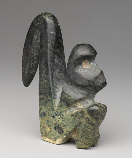 official museum photo of the monkey serpentine sculpture, side profile view 1 on grey gradient background