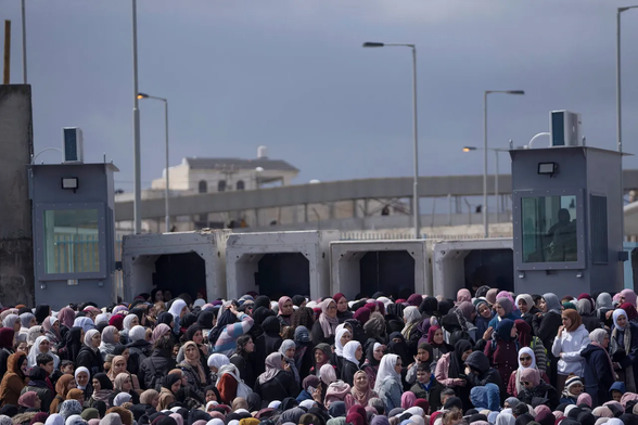 Palestinian women at an army checkpoint, waiting to cross into Jerusalem for Ramadan prayers last Friday. Settlers and their supporters in Israel proper want to seize control of most of the West Bank and to wipe out the separate identity and national aspirations of the Palestinians.Credit: Nasser Nasser/AP