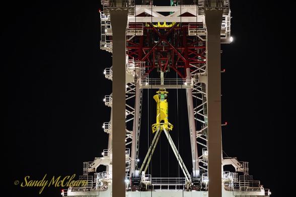 Closeup of the crane at night.