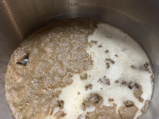 Krausen on the top of fermenting beer with part of it skimmed of the scum that forms from the hops material and proteins. Not letting this settle back into the beer reduces the unpleasant bitter compounds and makes for a smoother drinking beer.