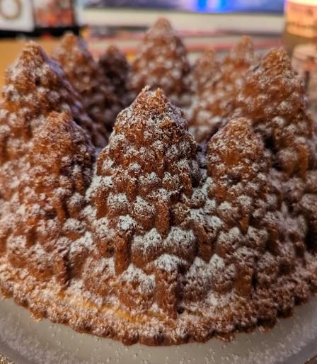 2) A close up of the same bundt cake, showing the pine-tree shaping of the sides of the cake.
