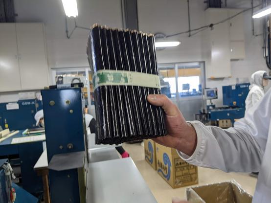 A bundle of 100 sheets held up