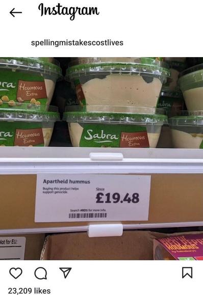 Containers of hummus on a store shelf with a label that carries a political statement and a price tag. The Instagram interface is visible, showing the account name and likes for the post.
