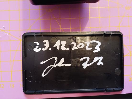 the back side of the lid. it has the date of completion and my signature written with white Edding marker