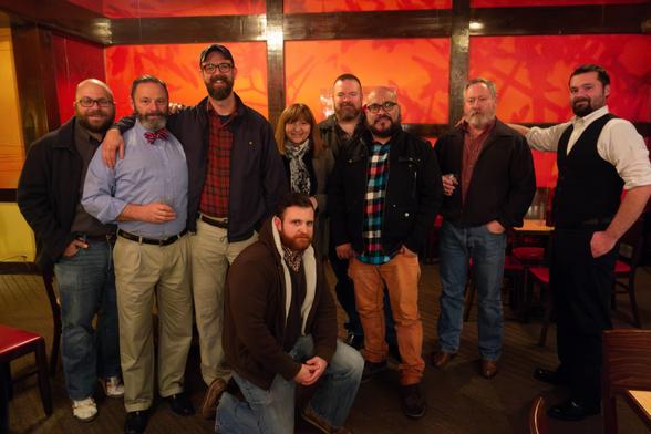 A group of folks pose in Benihana