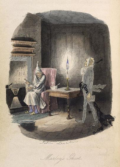 Famous miser Scrooge is warming himself in front of a tiny fire when the ghost of his deceased partner Marley walks in to the room dragging many heavy chains behind him a Victorian ghost story