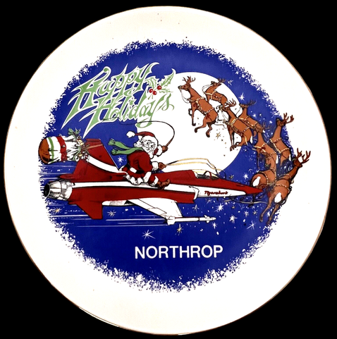 Northrop Plate - text reads "Happy Holidays". Image is Santa On Tigershark Jet with reindeer's  Reindeer