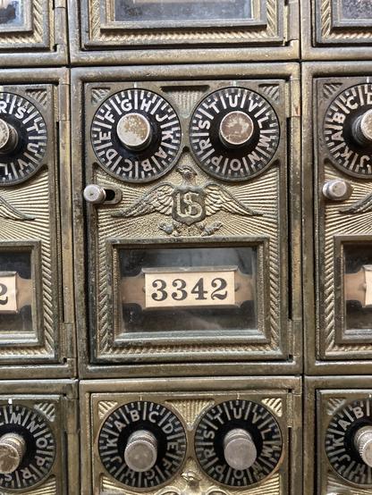 Very fancy looking brass mail box with dual dials, beautiful numerals and US eagle emblem