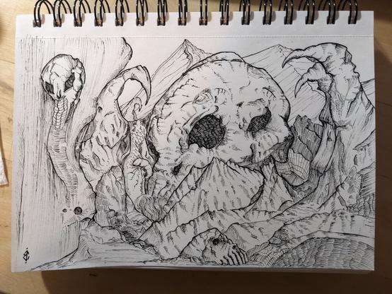 A black ink drawing of a rocky landscape. A giant skull dominates the view. The entire drawing is rendered in chaotic shading and contour lines.