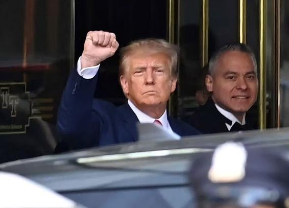 Trump with raised fist.
