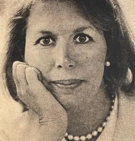 Sheila Moriber Katz, in the 1980s; a white woman with dark eyes and dark hair in a bob; she is resting her jaw in the palm of one hand
