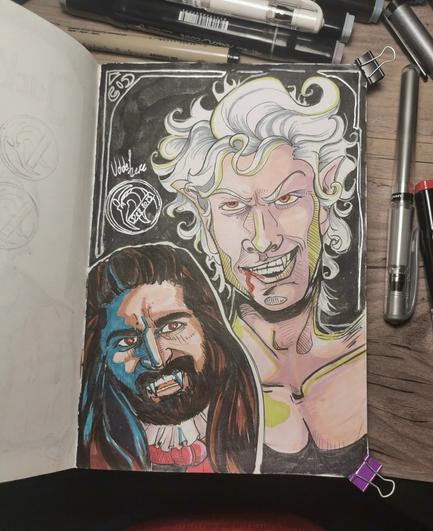 Foto of a Sketchbook. Two male characters. First is Nandor from What we do in the shadows (description in former post). Second is a buste of Astarion from Baldurs Gate 3. White pale male, attractive features,r ed eyes and fangs, white short and tousled hair. Looking cocky.