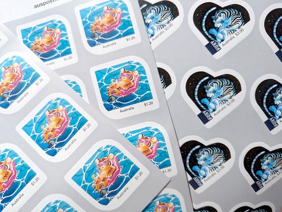 A photo of sheets of Australia Post stamps with custom art