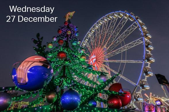 A caption says Wednesday 27 December. On the background is a montage of seasonal attractions - close up of a bauble, a Christmas tree, and the Lambeth wheel at night.