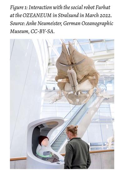 Interaction between a visitor and the social robot Furhat at the OZEANEUM museum, with a large whale skeleton hanging overhead.