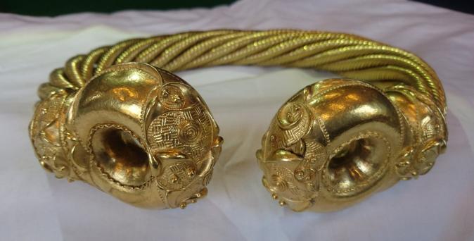 The Snettisham Great torc - a highly decorated neck ring made in gold, with elaborately decorated terminals.