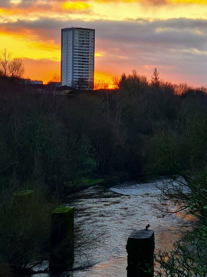 Looking down a river valley towards a winter sunrise.