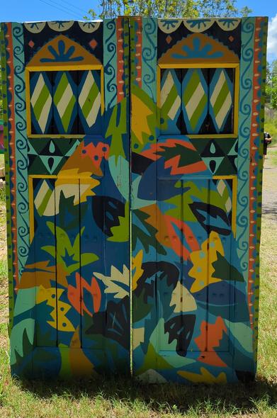 A painted pair of doors on the way to artisan alley
