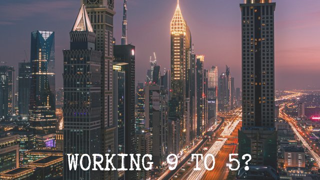 A view of an unnamed city at night with the title of the post ‘Working 9 to 5?’ across the bottom of the image