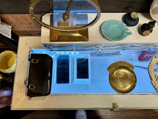 “Old” iPhones in an antique store display.