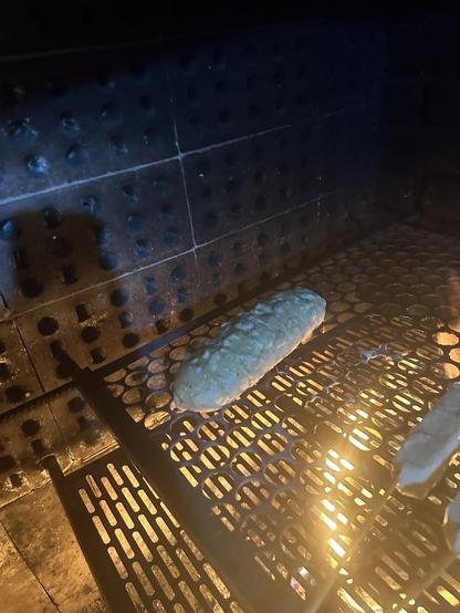 Raw garlic bread on the barbecue thing
