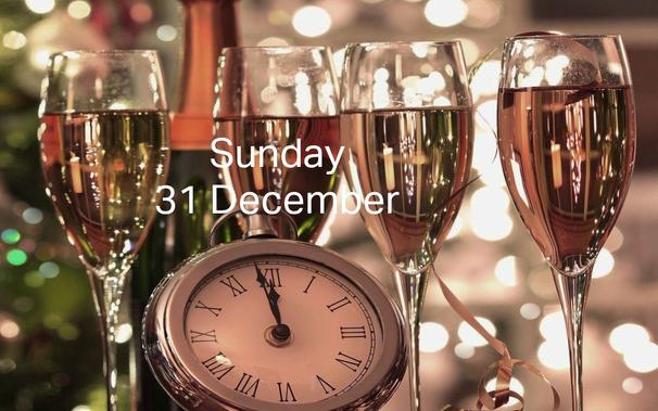 Caption: Sunday 31 December
Background: four Champagne glasses and a half-empty bottle, lit with reflected and refracted fairy lights. A pocket watch is set to 11.58.
