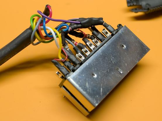 After: More components crammed into the connector, more shrink tubing, it looks quite ugly. Did I mention that I hate soldering connectors?