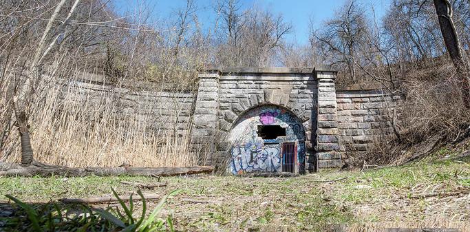The Merriton Tunnel, also known as the Blue Ghost Tunnel, is an abandoned tunnel on the former Grand Trunk Railway running under the Welland Canal in Ontario.