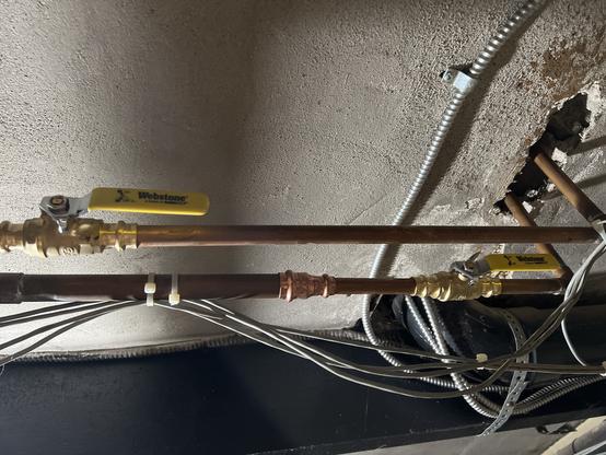 Ball valves in the open position for hot and cold water.