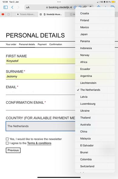 Screenshot of an online booking form titled "Personal Details" with fields for first name, surname, email, and confirmation email filled out and a country dropdown list for payment methods. The countries are not sorted alphabetically nor in any recognisable order.
