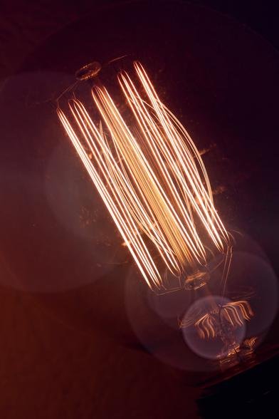 Close up photo of the filaments inside a fancy lightbulb.