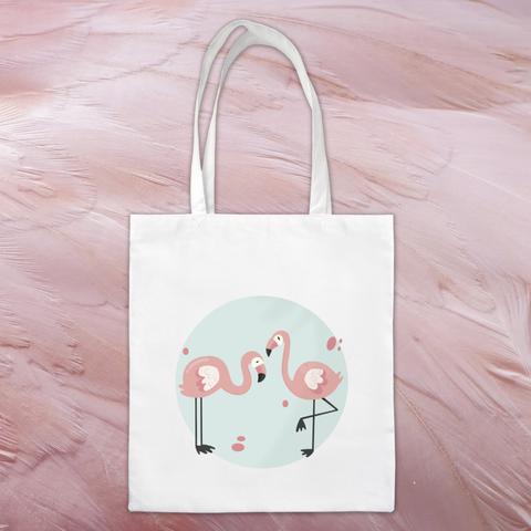 Tote bag 100% coton représentant deux flamants roses sur fond bleu. A retrouver dans notre boutique en ligne : ernestine-etcie.fr