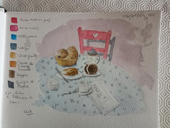 Sedia rossa, croissant, caffè, zucchero, palette di colori
