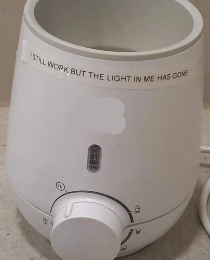an appliance with a sticker that says "I STILL WORK BUT THE LIGHT IN ME HAS GONE"