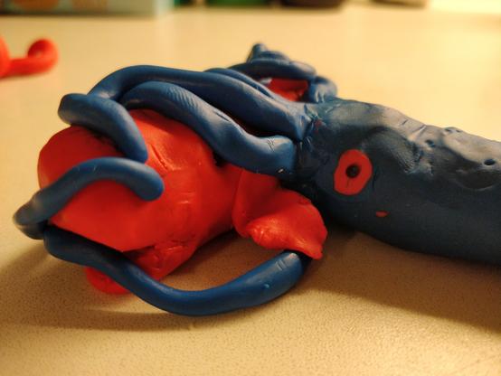 Closeup of the squid attacking the whale. Apparently the whale is trying to fight back, because it has one of the tentacles in its mouth.