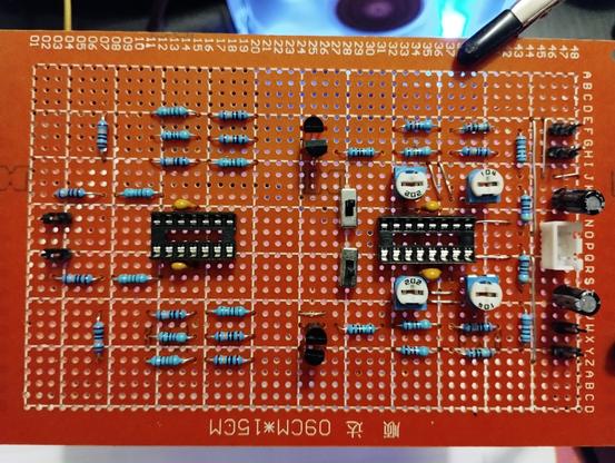 front side of the current progress of soldering the perfboard. a few resistors are missing in the middle and the two big potentiometers. the jumper wires on the right side are already placed