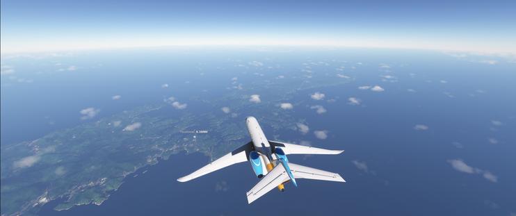 A Cessna Citation Longitude in Microsoft Flight Simulator flying over Tsushima on a bright morning.