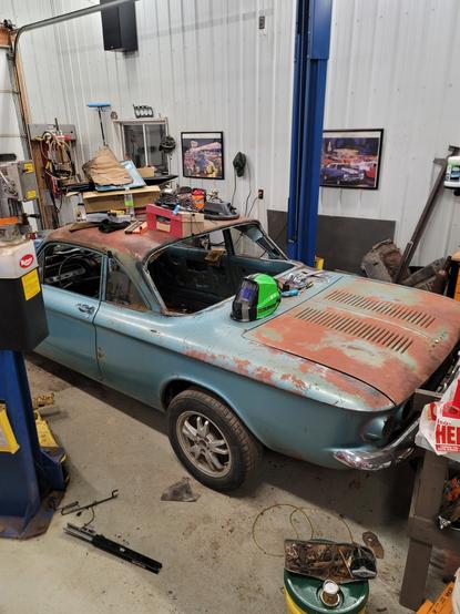 The rear quarter panel of a Chevy Corvair