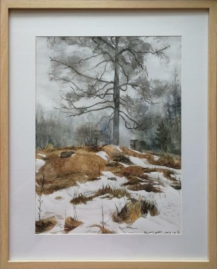 A framed watercolour painting of a leafless tree in a snow-patched brown landscape.