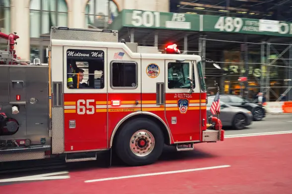 New York Fire Department truck with the sirens on.