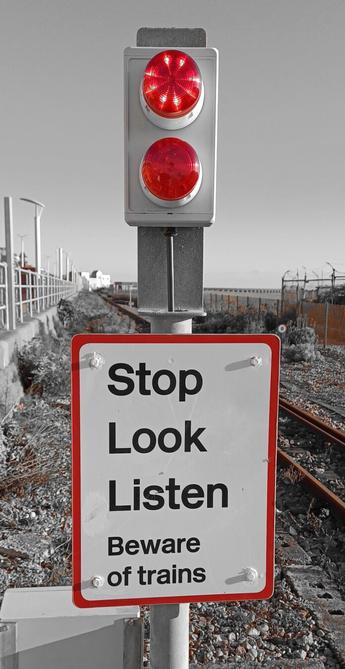 Mini Volks Railway on Brighton seafront. Warning lights and sign to look out for old trains coming