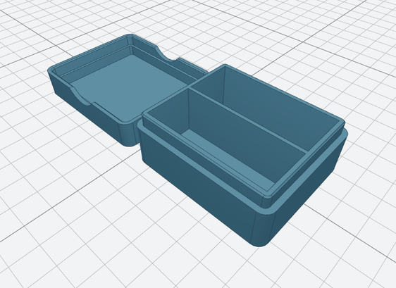 Simple rendering of a box and lid on a gridded background. The box has rounded corners and an internal divider.