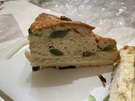 Slice of three kings cake with only the foot of the baby showing