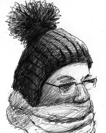 Woman with glasses and wool cap