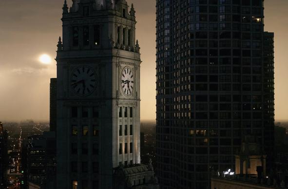 The Wrigley Tower glows ominously in the post storm, cyberpunk mist as the sun struggles to break through.