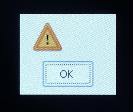 An error pop-up with no info. Just an amber triangle with an exclamation point in it, and an OK button.