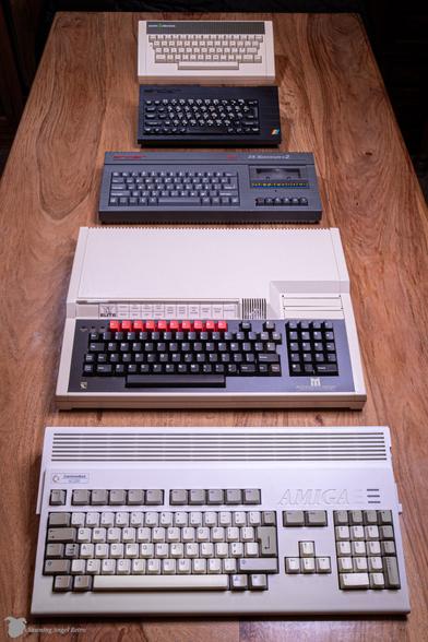 A collection of retro computers: Amiga, BBC Masters ZX Spectrum +2, ZX Spectrum +, Acorn Electron.